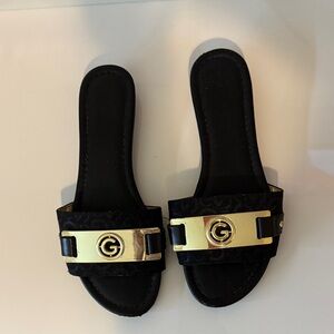 G by Guess Black and Gold Slide Sandals